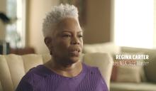 Regina Carter sitting in her home speaking to the interviewer