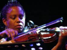 A woman playing a violin.