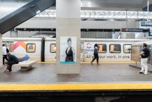 View of a portrait from MARTA's Artbound program on display in a MARTA station