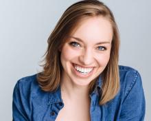 Headshot of a woman smiling.