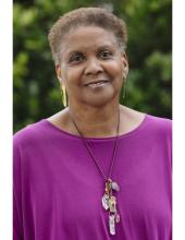 Denise Fairchild, who is an older Black woman with short salt and pepper hair