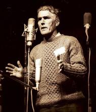A man speaking into a microphone.