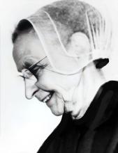 Headshot of a woman with a veil.