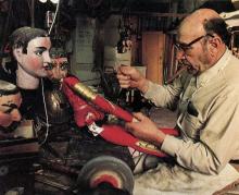 A man working on a puppet.