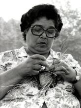 A woman making a basket.