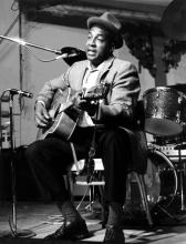 A man playing a guitar.