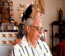 A man and a woman looking away from the camera.