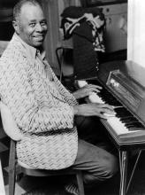 A man playing a piano.