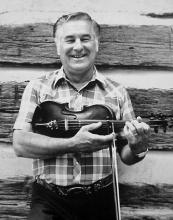Man holding a fiddle.