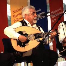 A man playing an Oud.