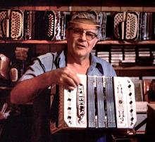 Man holding an accordion.