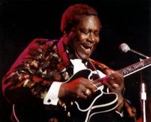 A man playing a guitar.