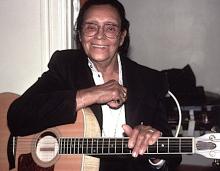 A man holding a guitar