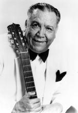 A man holdinga guitar.