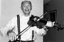 A man playing a fiddle.