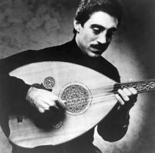 A man playing a laud.