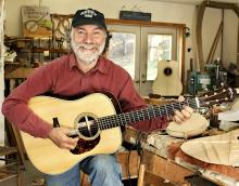 A man playing a guitar.