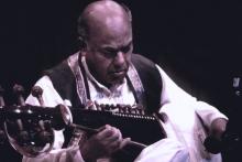 A man playing an instrument.