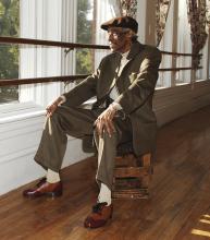 A man sitting by a window.
