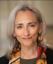 headshot of an older Latina woman with long gray hair