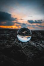 a marble reflecting the sunset