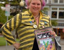 Woman holding a publication.