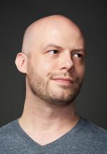 a young, bald white man