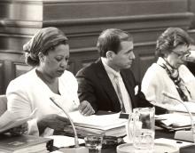 Author Toni Morrison with notebook and microphone serving as a panelist