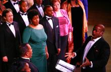 Everett McCorvey (right) directs the American Spiritual Ensemble in a performance at the John F. Kennedy Center for the Performing Arts in 2009. Photo by Jonathan Palmer