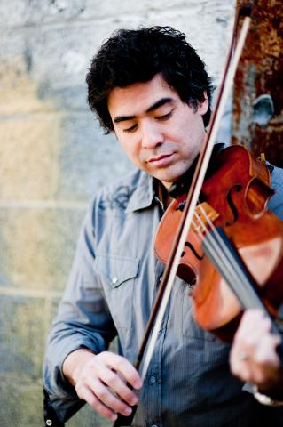 Portrait of Japanese American man playing a violin.