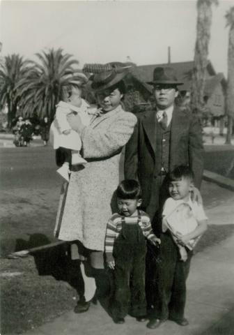 Japanese family standing outside in early 1940s