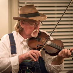 A man playing the fiddle.