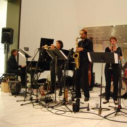 A band playing at a museum.