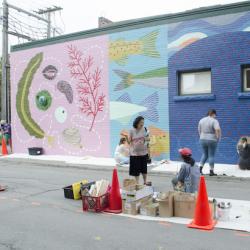 artistsatworkpaintingamassivemuralofmarinelife