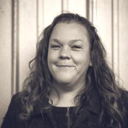 black and white photo of Jen Rouse who is a white woman with long wavy hair