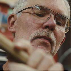 Close up of Todd Goings with woodworking tool