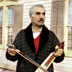 A man holding a string instrument.