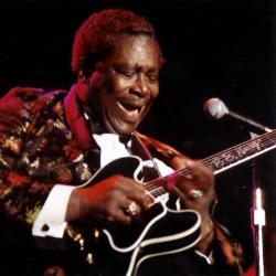 A man playing a guitar.