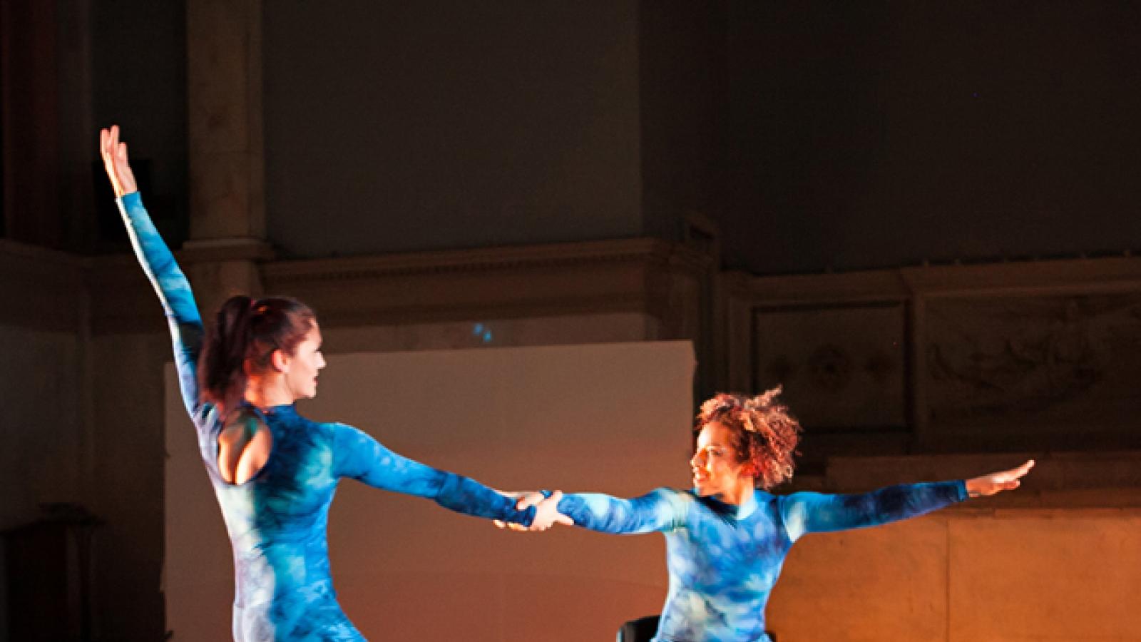 Two dancers in wheelchair and standing Two dancers in wheelchair and standing