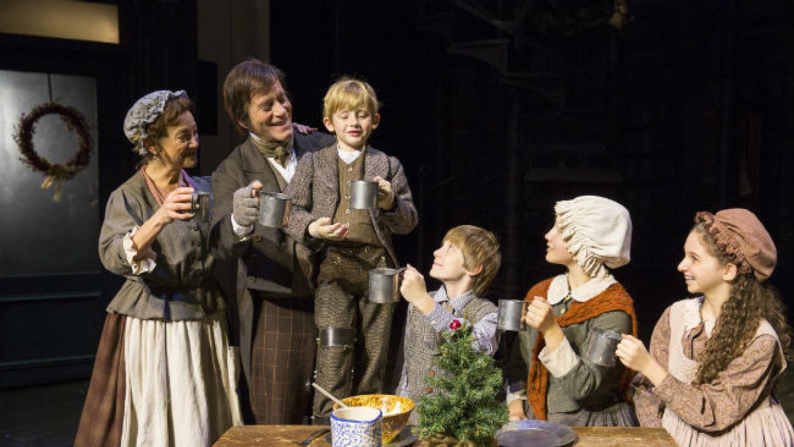 Tiny Tim toasting Christmas with his family from A Christmas Carol Tiny Tim toasting Christmas with his family from A Christmas Carol