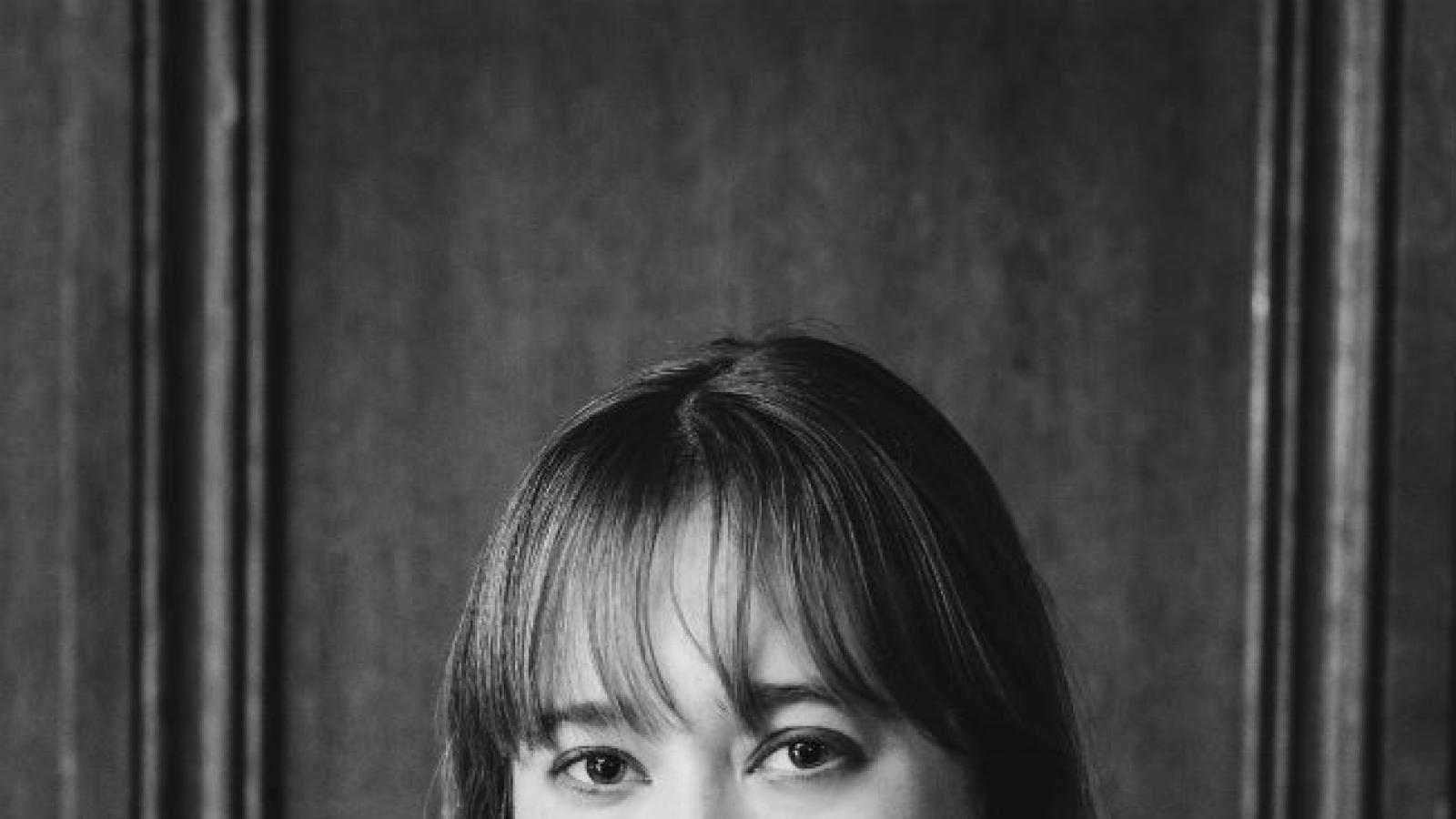 Black and white photo of woman with bangs