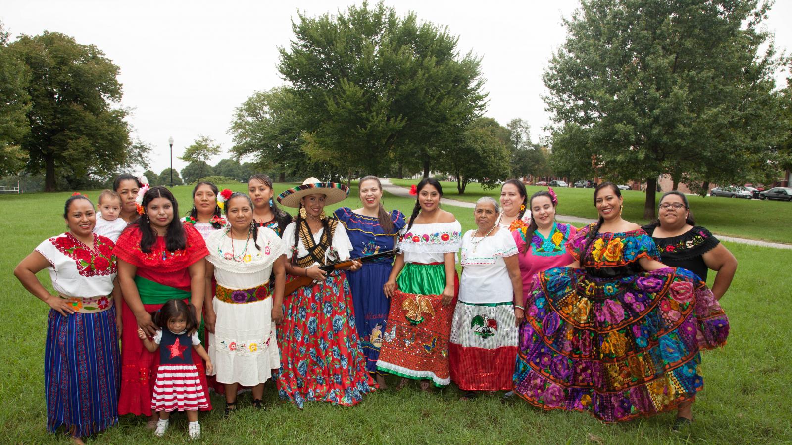 A group of Latin American women some in traditional dress