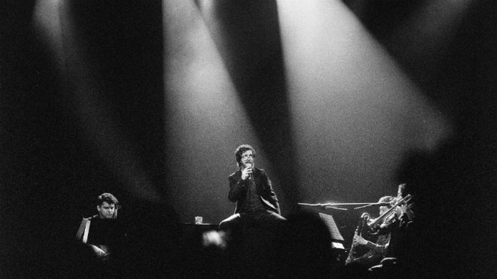 Ben Folds performing onstage with orchestra