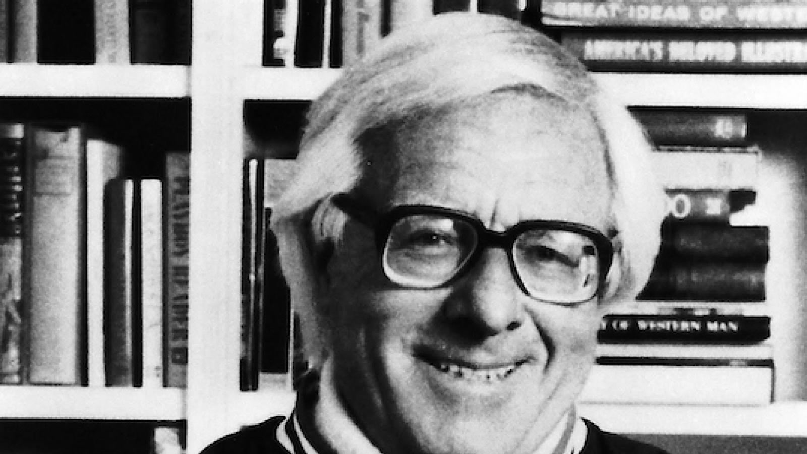 author Ray Bradbury posing with a cat