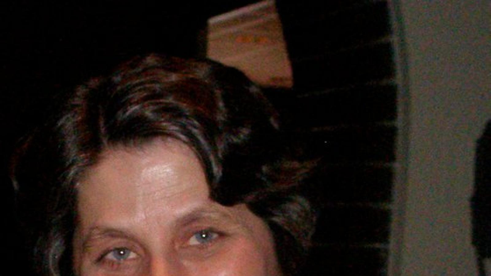 Head shot of woman with brown hair Head shot of woman with brown hair