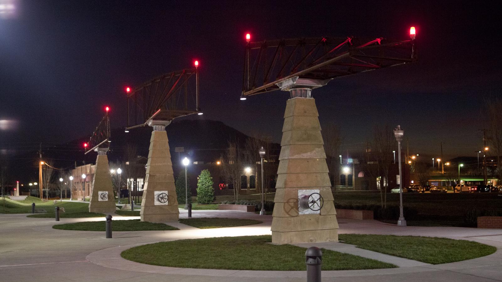 The Main Terrain is an urban park in Chattanooga, Tennessee that features several pieces of public art including a sculpture modeled from cast concrete pylons and steel trusses that can be turned using a wheel at the base.