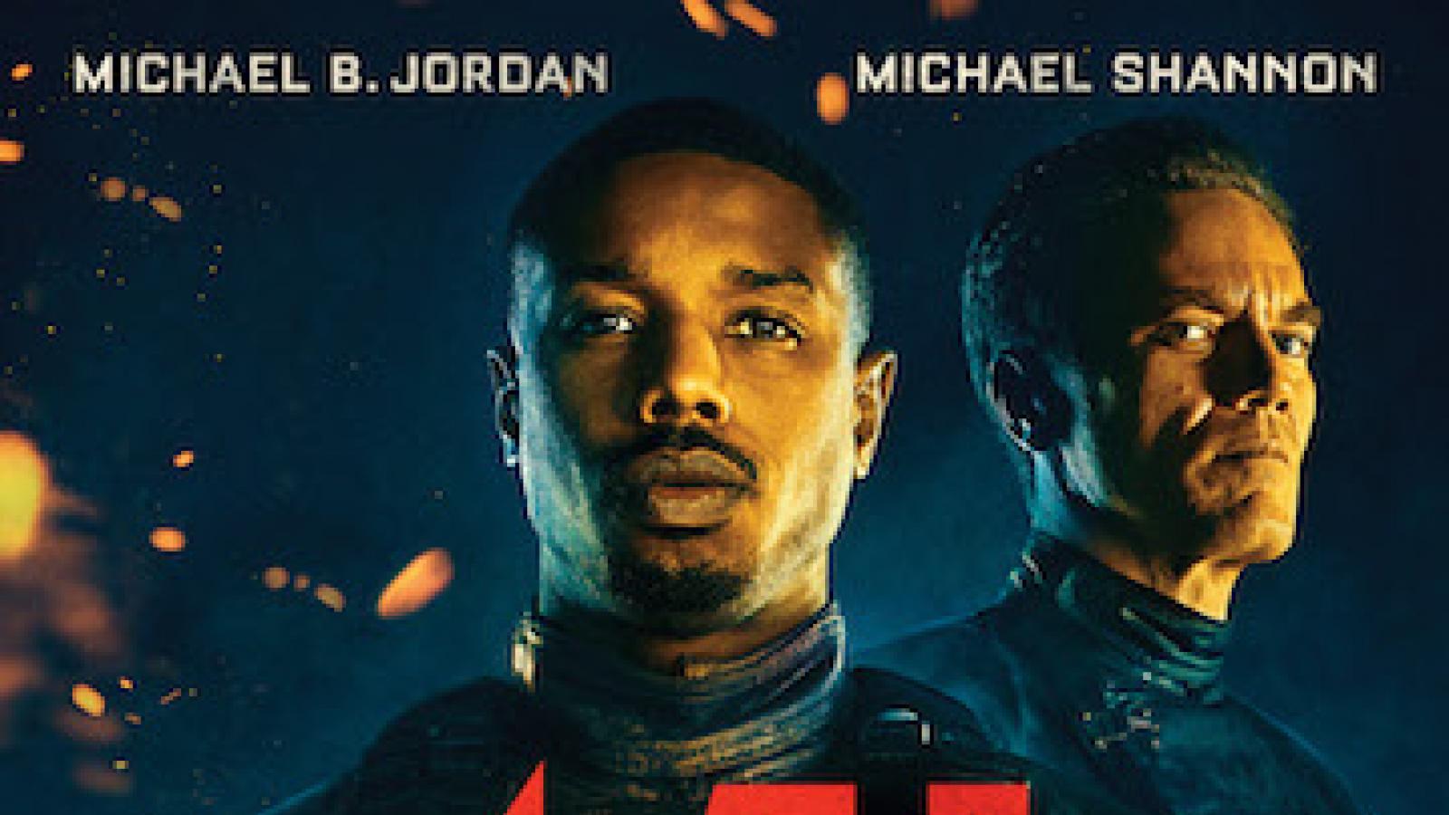 actormichaelbjordanholdingbookonfireandmichaelshannonbehindhim