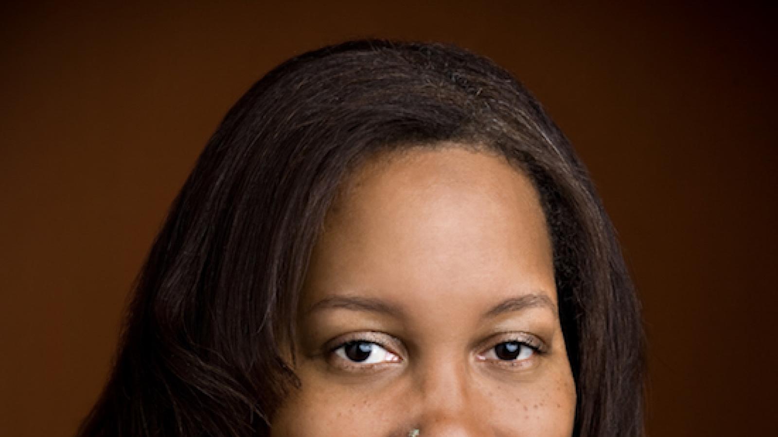 a medium-complexion African-American woman with a nose stud
