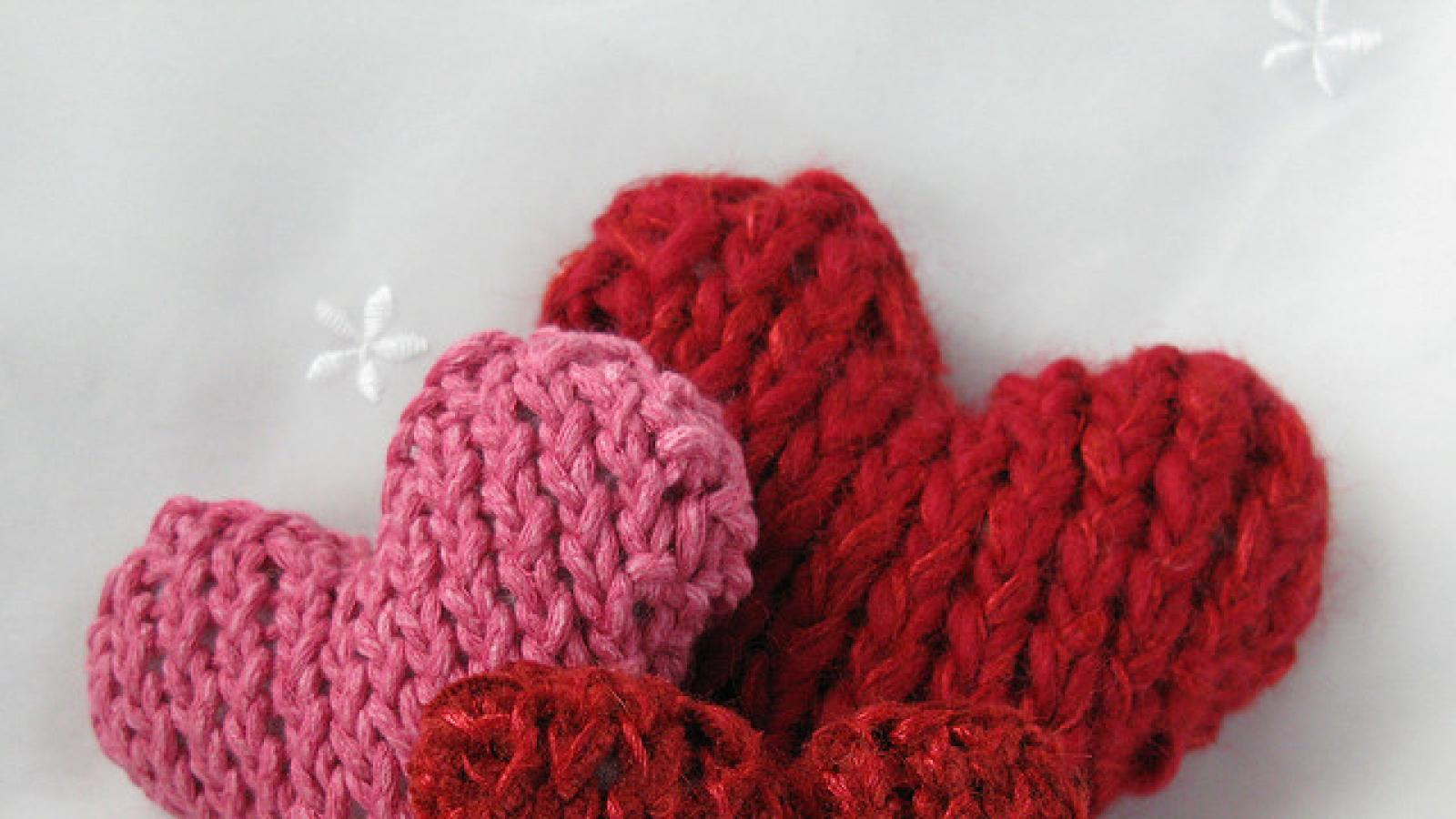 Three knitted hearts