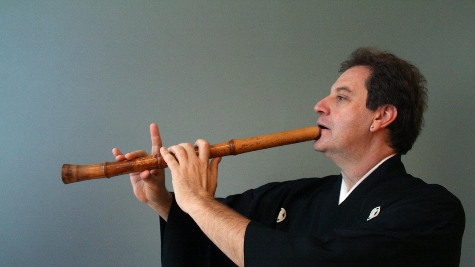 James Nyoraku Schlefer playing an instrument. 